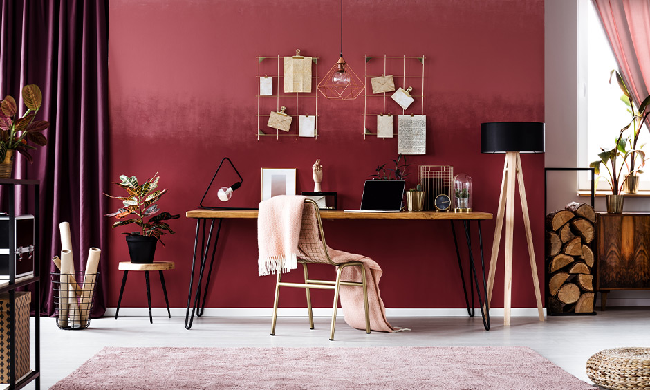 Study room, designed with a monochromatic red colour scheme, emanates warmth and cosiness
