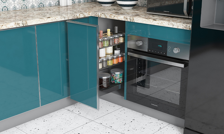 Precast terrazzo tiles in the kitchen complement the blue cabinets and cream granite countertop