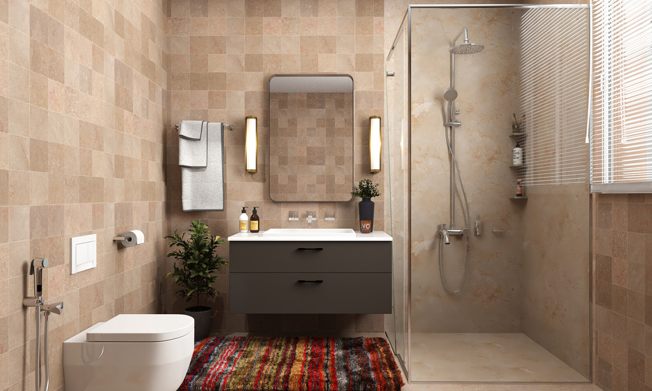 Modern corner walk-in shower with glass enclosure, complemented by ceramic tiles for a spacious, airy bathroom