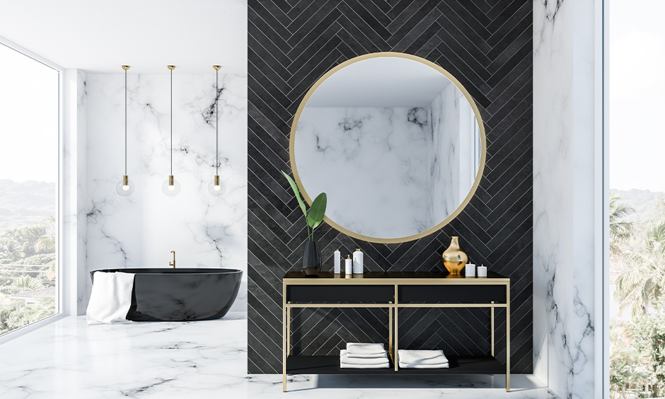 Herringbone patterned black marble panelling for the bathroom which is easy to maintain