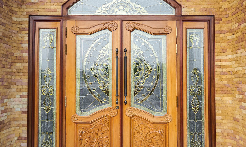 Intricate CNC-carved wood design provides a sophisticated touch to the main entrance's aesthetic appeal