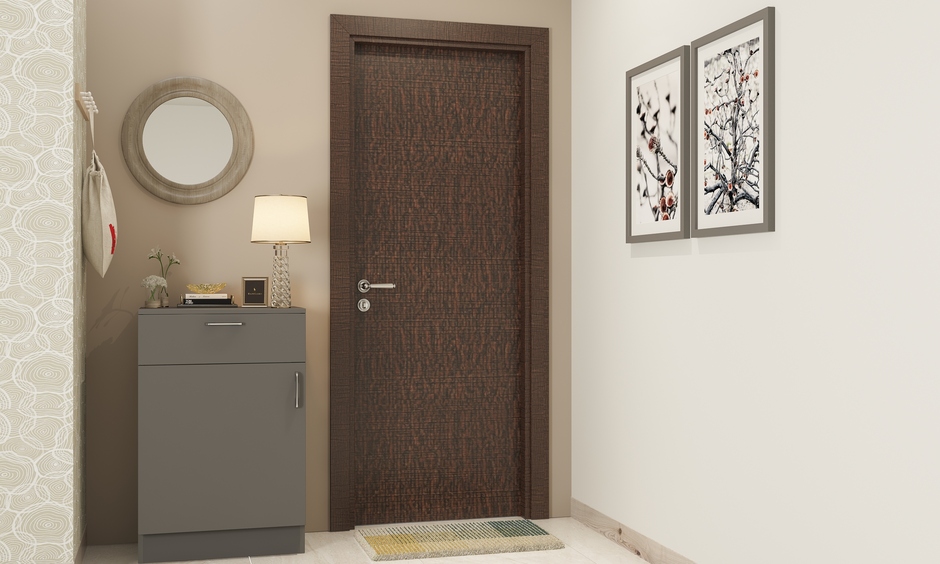 Crisscross patterned flush door with mica accents showcasing rustic craftsmanship in a charming country-style entryway