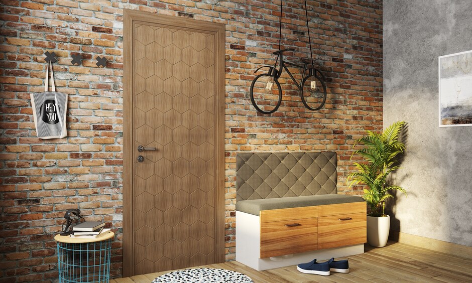 A flush door with a honeycomb mica design that adds an industrial touch to the home's entryway