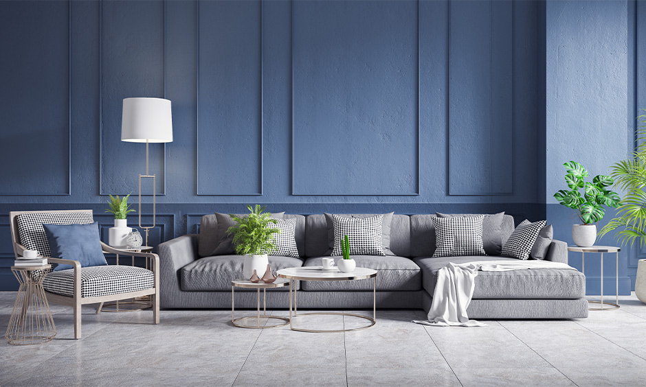 Grey cement floor design paired with blue walls for the right vibe