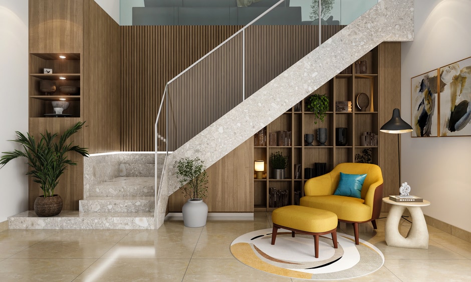Indoor glass railing design for the stairs, complemented by a comfortable reading nook underneath
