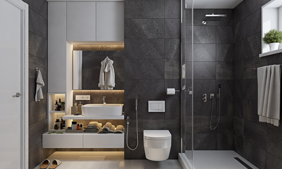 Attach bathroom design with patterned smokey grey wall tiles to give off an industrial vibe