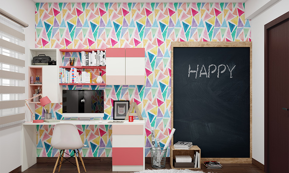 Geometric wall paint in a kid's bedroom enhances the study area by creating a playful and uplifting atmosphere for learning