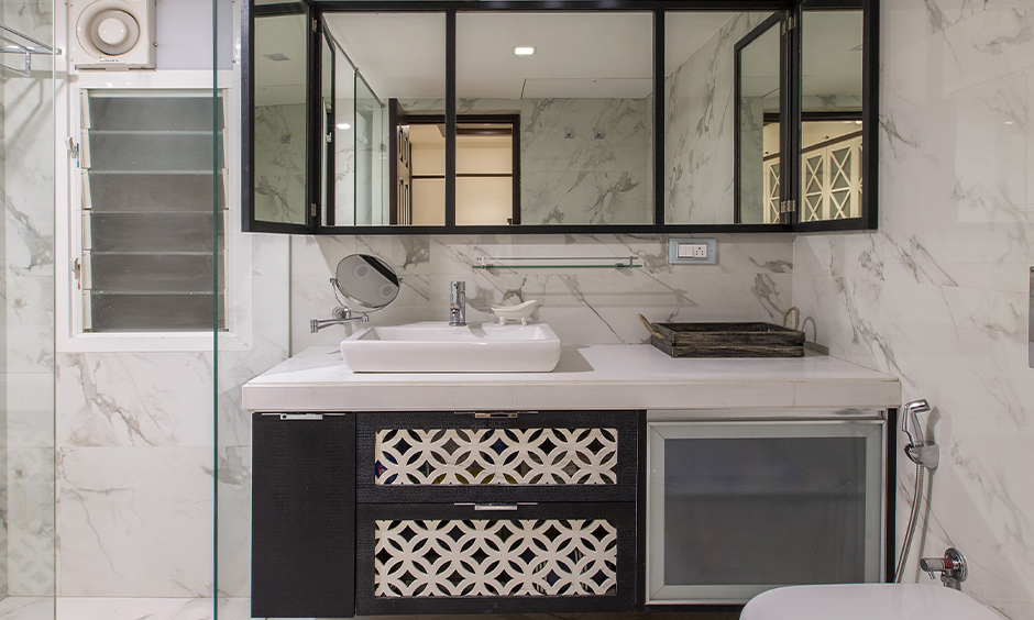 A small attached bathroom design with a floating vanity enhances the sense of space