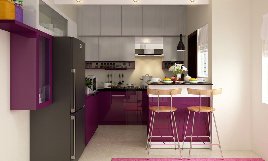 Small kitchen peninsula design in magenta and white with seating