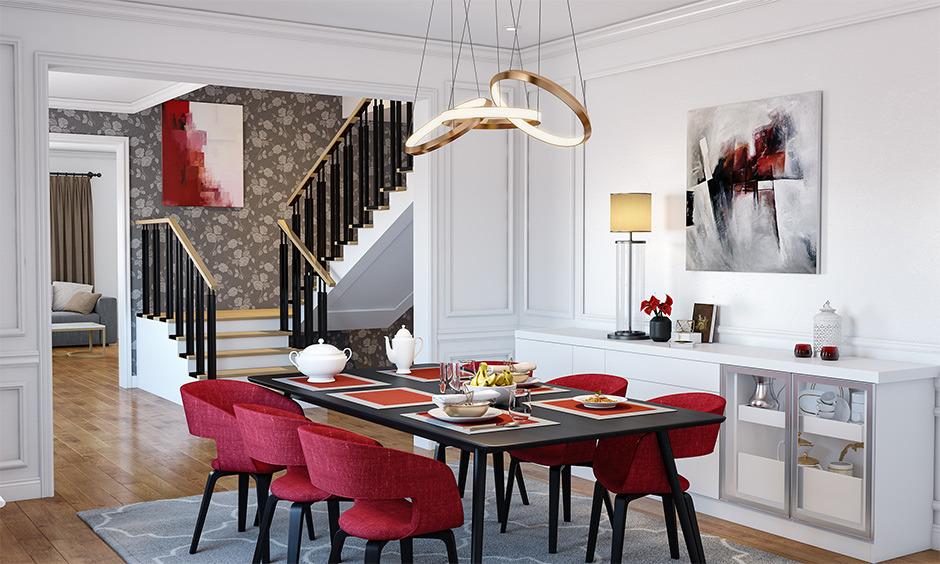 Dining room with black tables and red velvet chairs creates a striking black and red colour combination