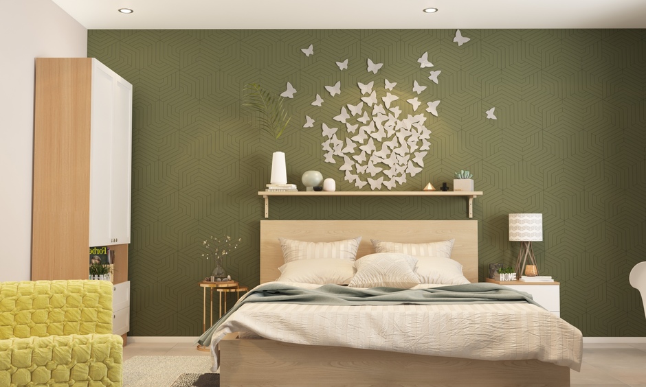 White butterfly wall stickers adorn an olive-green bedroom wall