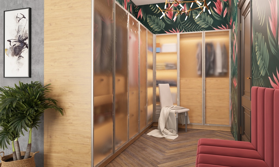 A corner l-shaped wardrobe design with a frosted glass front creates an illusion of space in compact homes