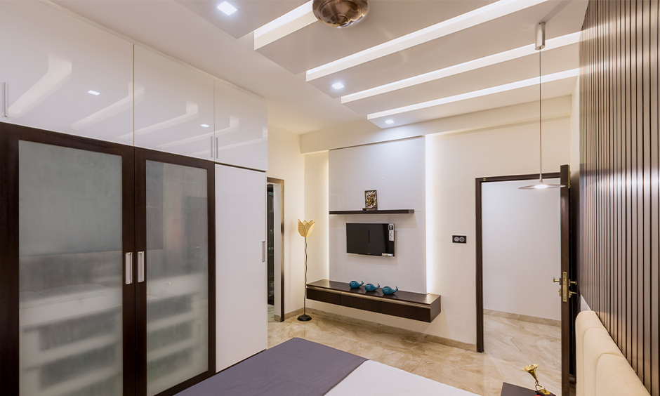 Serene down ceiling design for bedroom with white block-style, creating a cosy and relaxing ambience
