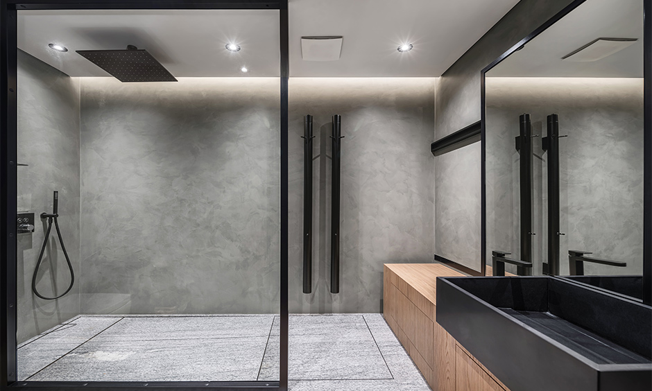 Grey bathroom with glass wall mirror