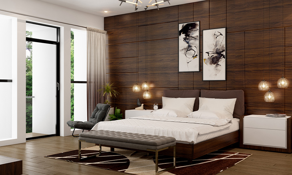 Dark brown plywood double bed design with straight edges and cosy bedding