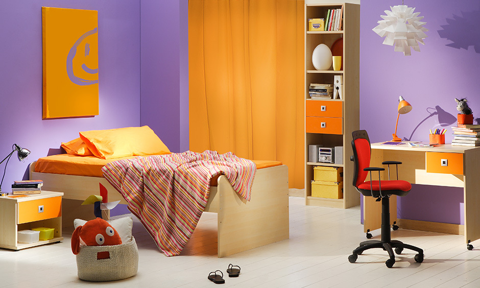 Kid's room with purple and orange wall colour combination, adding energy and warmth