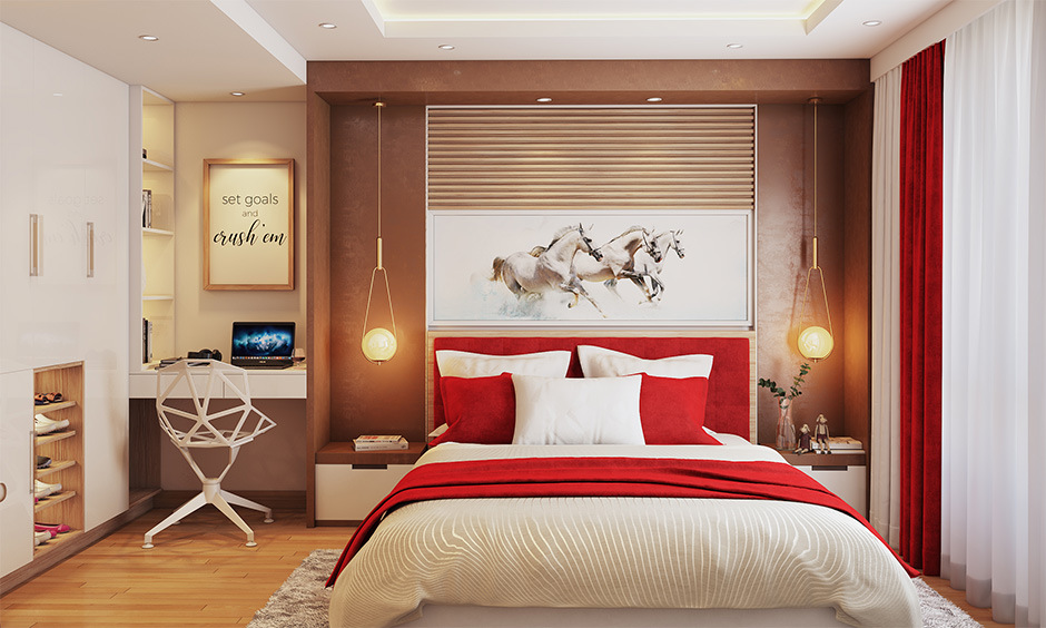 Bedroom with red and white colour scheme, stylish bedding, curtains, and warm lighting