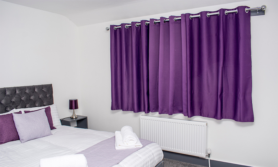 Purple window sill drapes in crisp and clean aesthetic
