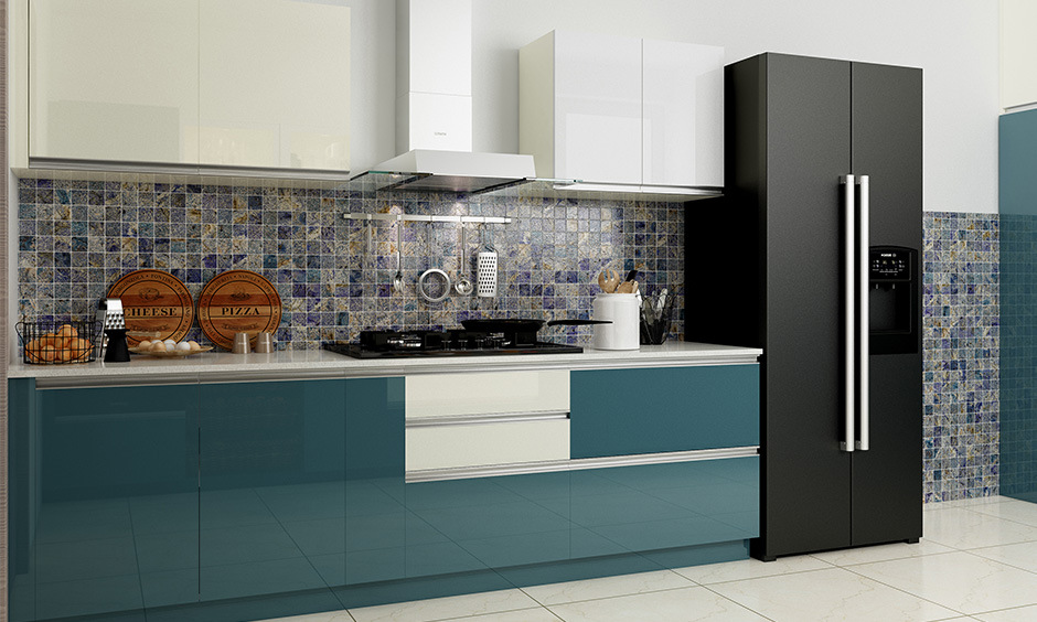 Blue and white kitchen wall tiles with geometric patterns and textured finishes, adding depth and character