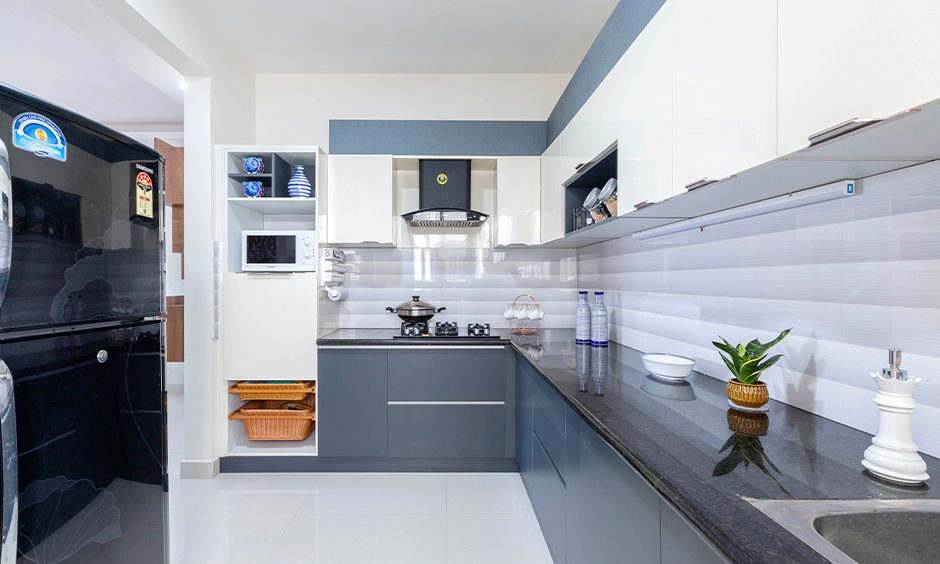 Bluish-grey and white kitchen laminates create a simple, formal look with depth and visual interest