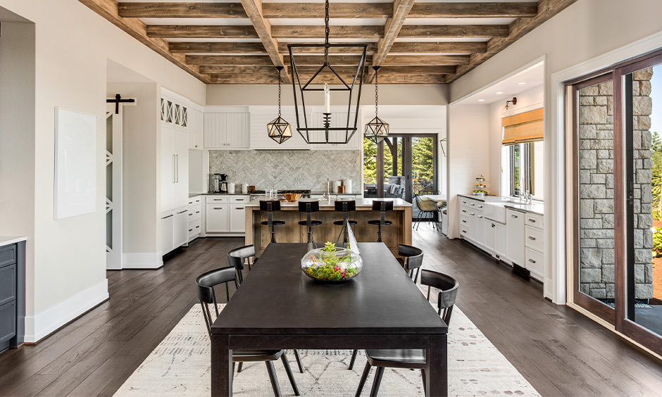 Sophisticated colonial-style dining room with abundant natural light, wood elements, and cohesive design