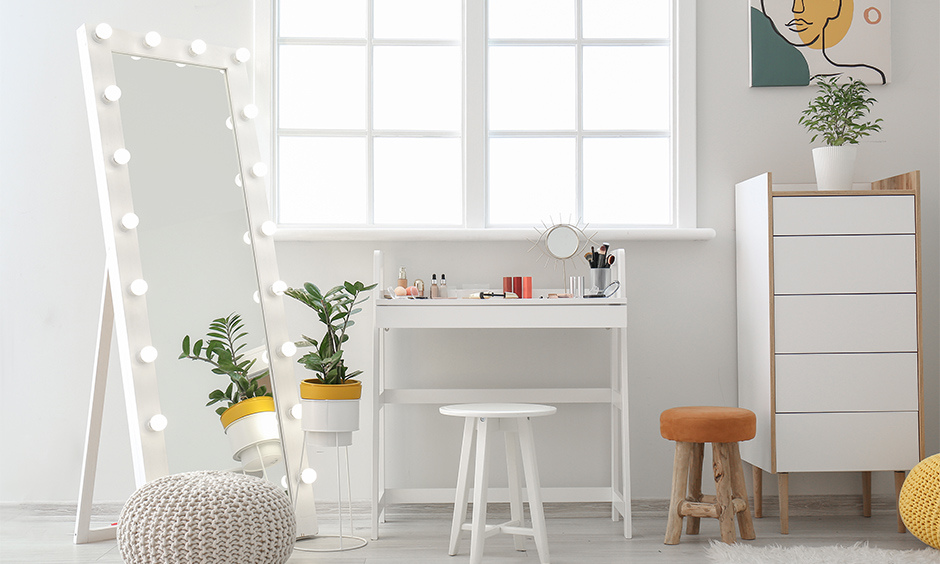 Modern white dressing table with ample surface, standing mirror, and compact design for small spaces