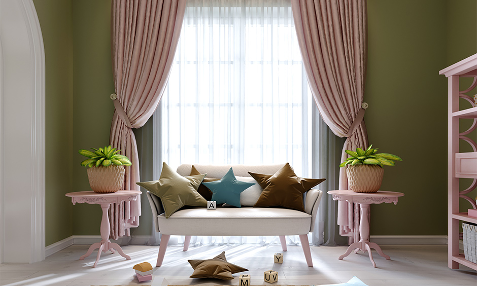 Pastel living room with lemonade pink furnishings, sage green accents, and beige couch for a chic, modern aesthetic