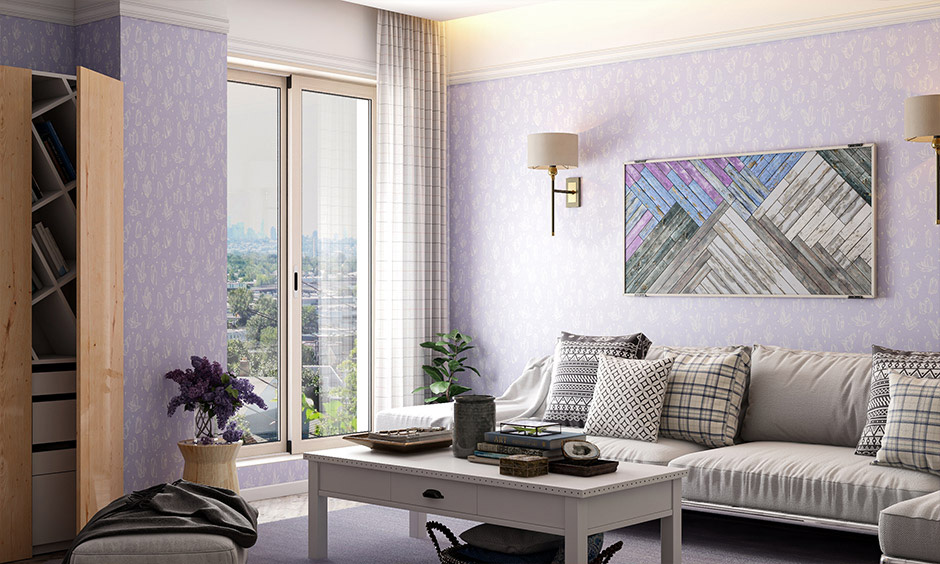 Pastel lavender wallpaper with white accents creates a chic, elegant living room