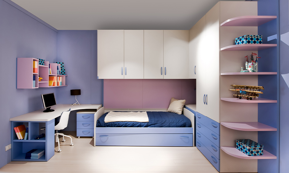 Charming single bed design for girls in pink and blue with space-saving storage shelf