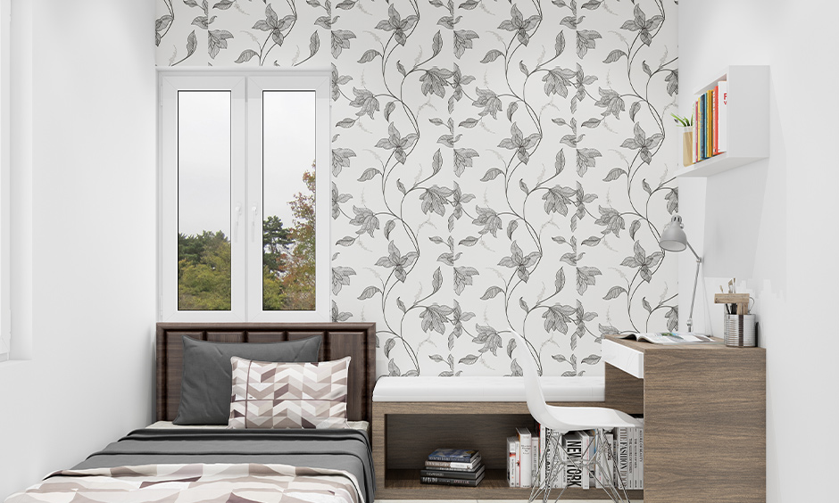 Floral-themed white colour wallpaper with earthy tones creates a calming, vibrant bedroom space