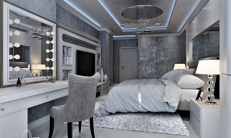 White contemporary dressing table with a reflective surface, brightening the room's grey and white palette