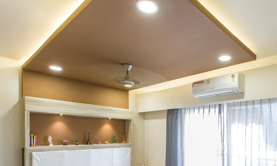 Calcium silicate false ceiling design with recessed lighting, adding a touch of glamour to the space
