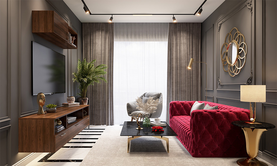 Wine colour room with a plush burgundy sofa and neutral decor creating a sophisticated atmosphere