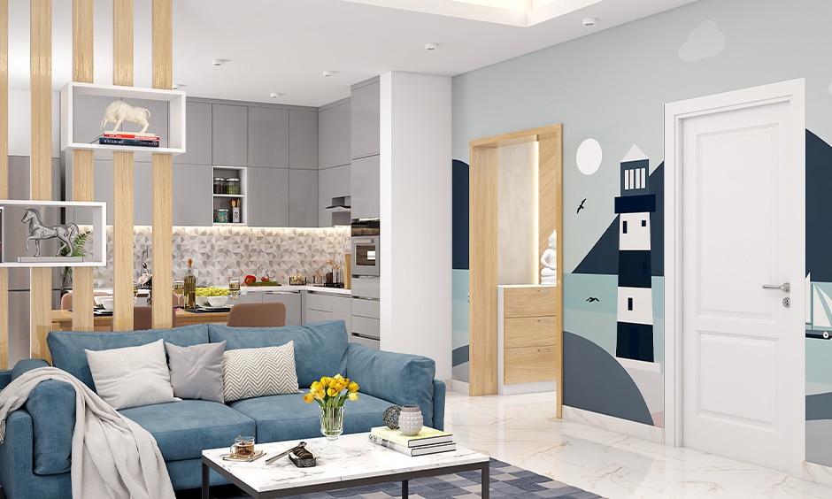 Modern coastal interior design living room with calming blues and lighthouse wallpaper