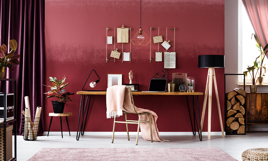 Elegant red wine colour wall paint creating a warm and inspiring study atmosphere