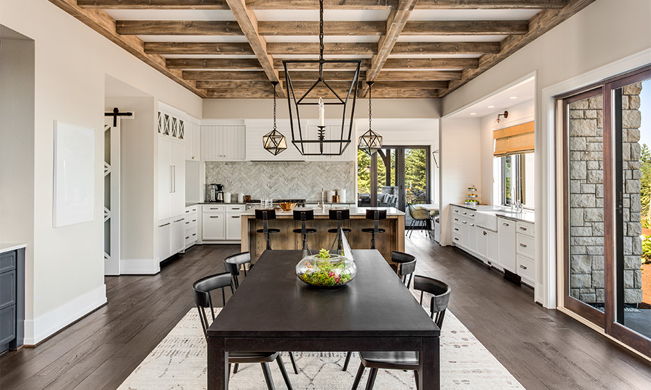 Ultra modern luxury kitchen design with expansive layout, natural light, and multitasking island