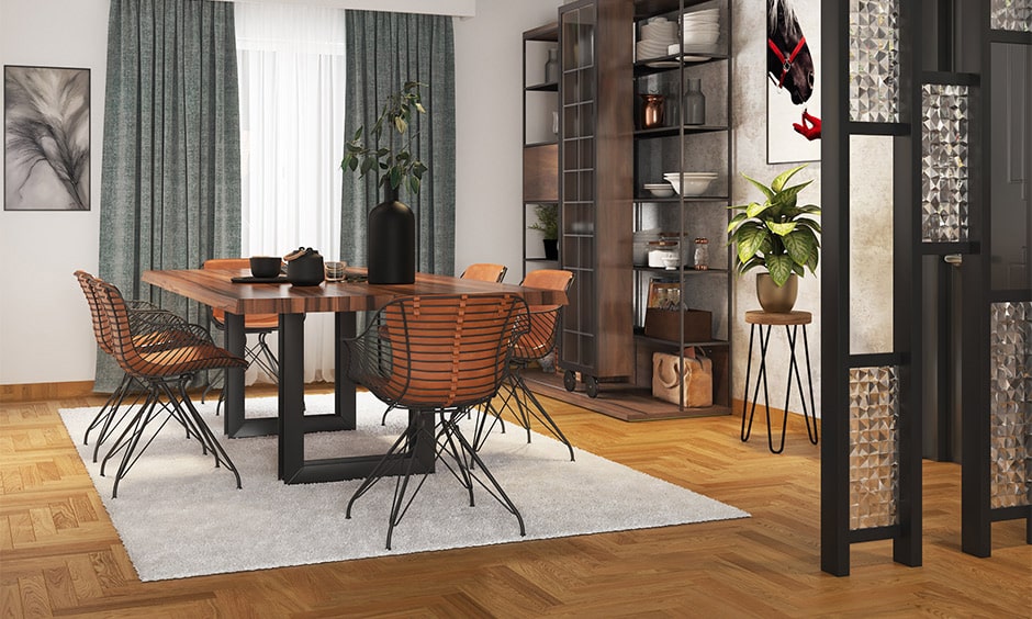 Dark bamboo laminate flooring in dining room with modern chairs and solid wood dining table