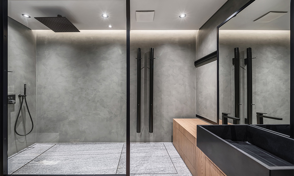 Grey bathroom floor tiles with textured patterns enhancing the aura of a private, stylish space.