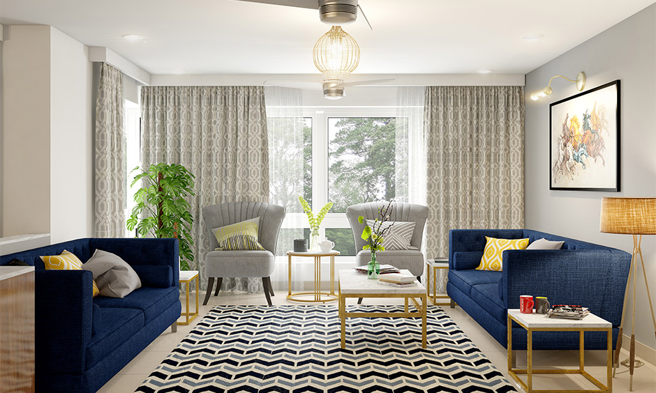 Modern blue sofa living room with layered throws, patterned covers, and complementary accessories