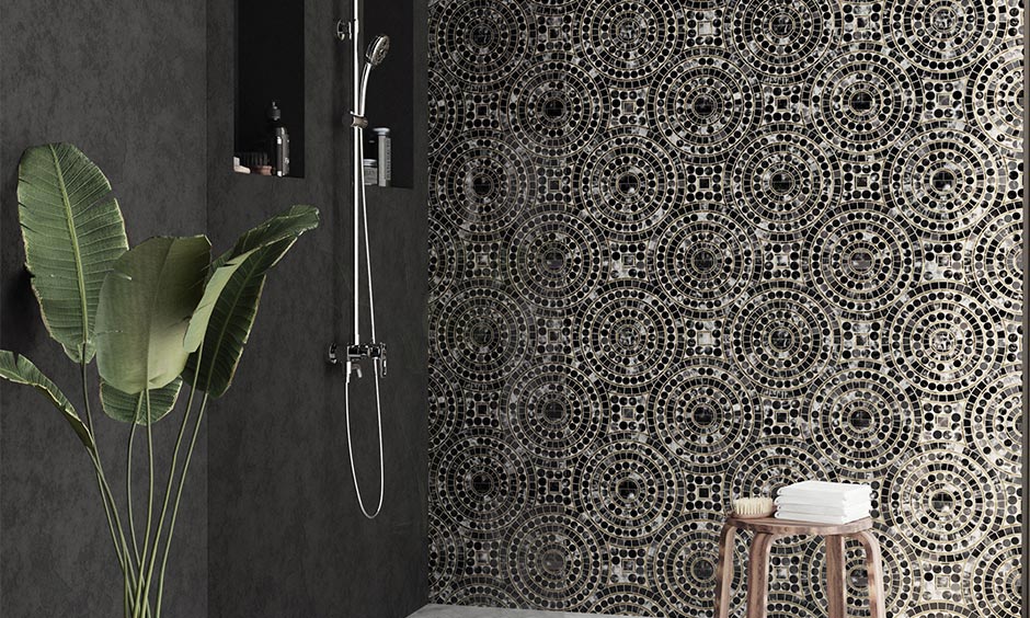 Mosaic grey bathroom tiles in a black interior, offering bold character and a dramatic, royal touch.