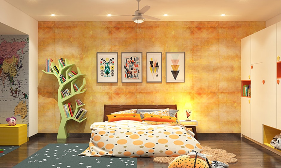 Personalized bed wall design with a gallery of framed photos and a stylish tree-shaped bookshelf