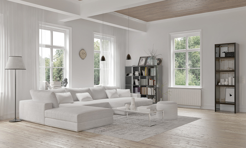 Minimalist white interior design with natural light and wooden floors fosters serenity