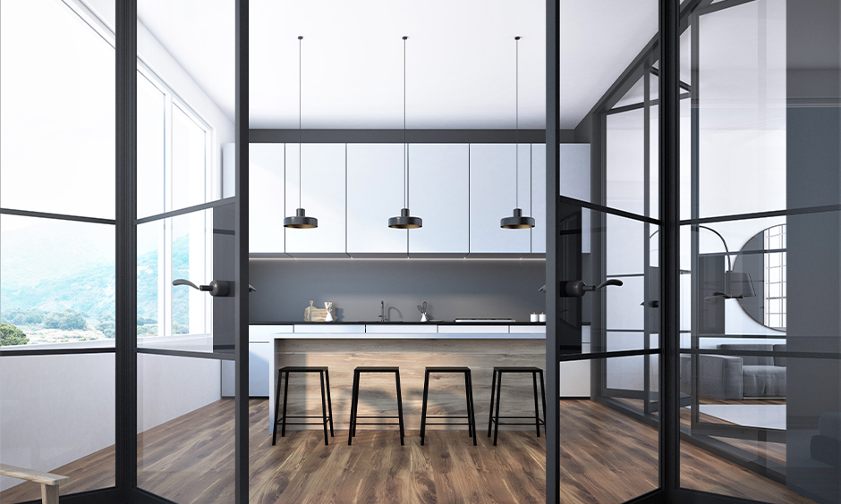 Chic black frame folding kitchen door with glass panels, creating an airy and sophisticated look