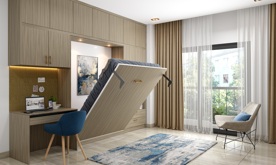 Smart built-in wardrobe design with Murphy bed and study table for space-saving efficiency.