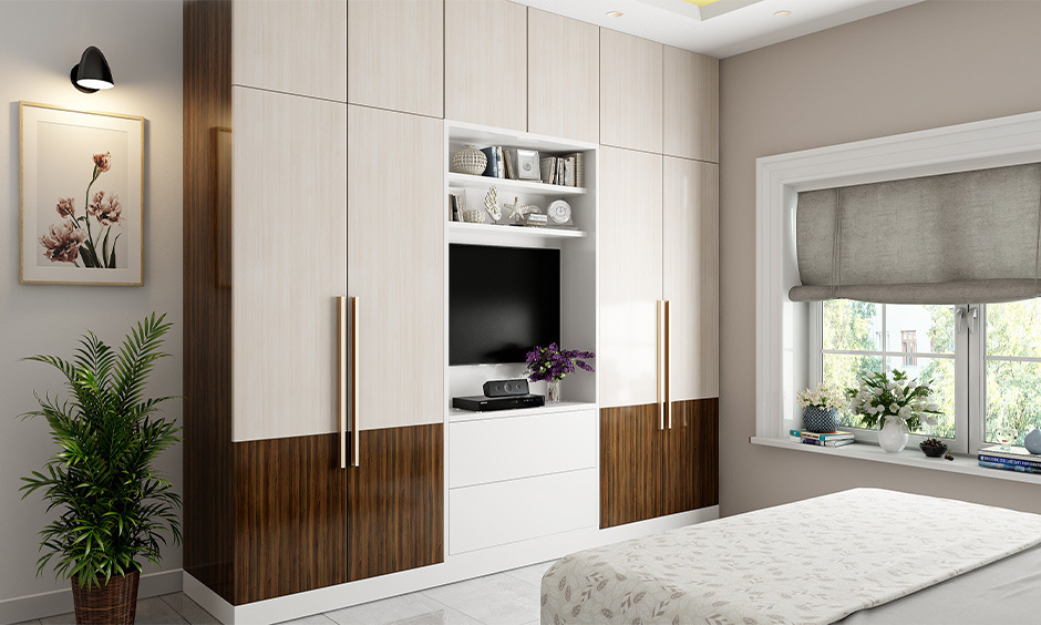 Space-saving built-in wardrobe idea with integrated TV unit, shelves, and stylish storage.