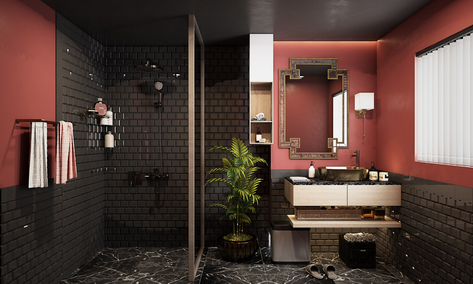 Black bathroom tiles with gold fixtures create opulence, while red walls and plants add contrast and calm.