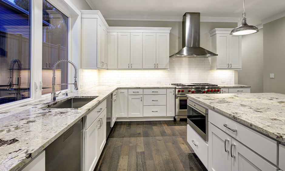 Kashmir White granite with soft white base and grey speckles, perfect for calm and balanced interiors