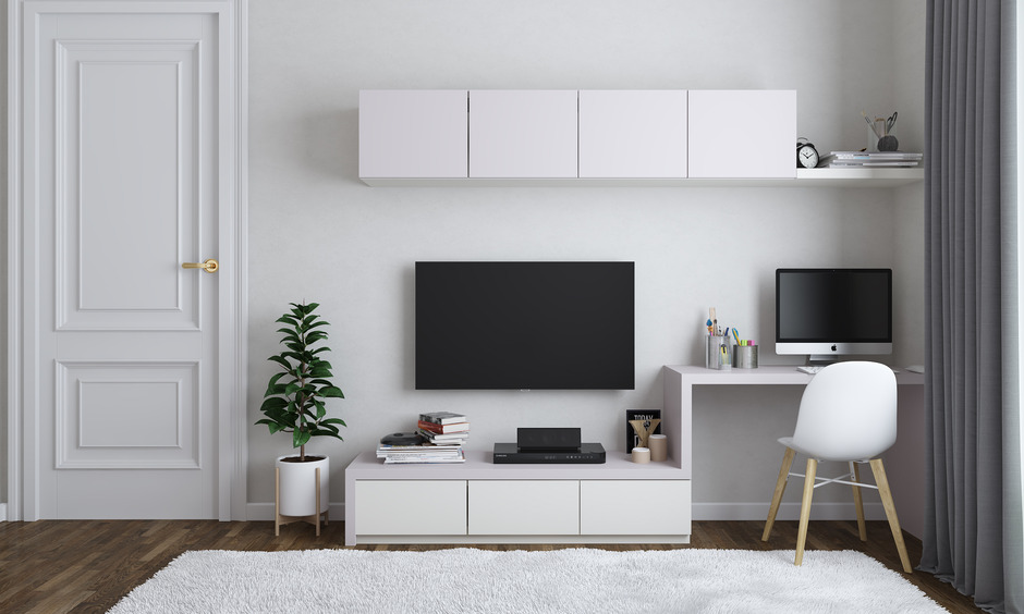Modern study table design for small room with integrated TV unit for work and leisure.