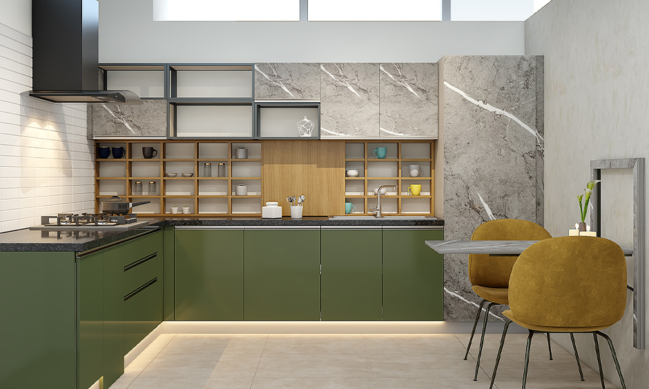 Chic kitchen with olive green cabinets, black countertop, marble wallpaper, and warm wood shelves for a cosy vibe