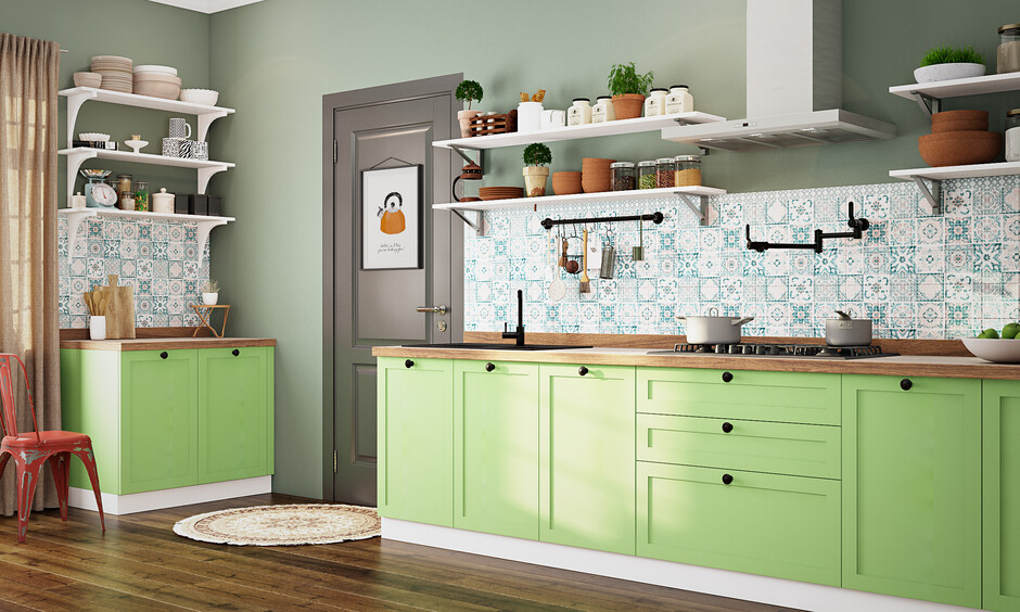 Charming kitchen with pista green cabinets, light countertops, blue backsplash, and white shelves for a fresh vibe